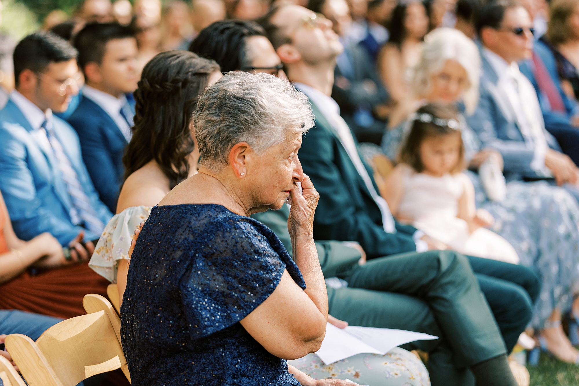 grandmother cries during wedding ceremony in garden at Bowman's Hill Wildflower Preserve