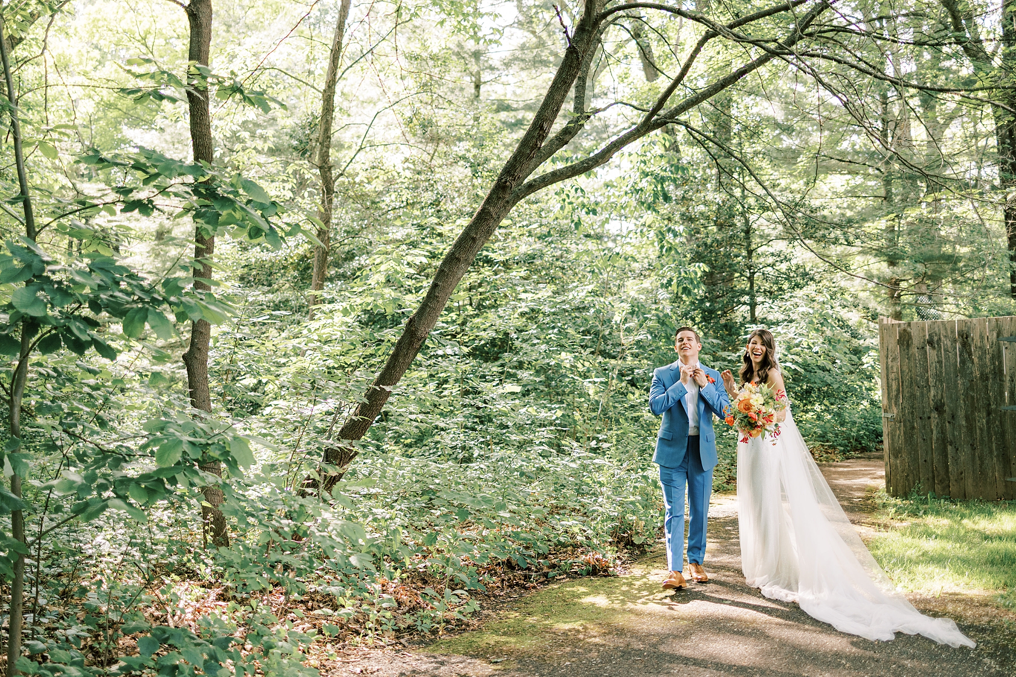 bride and groom stand together in woods at Bowman's Hill Wildflower Preserve