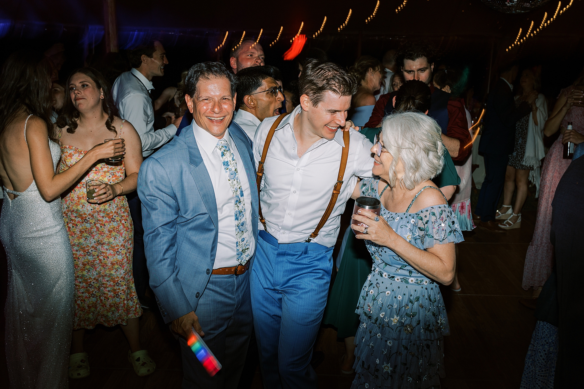 groom hugs parents during during silent disco at Bowman's Hill Wildflower Preserve