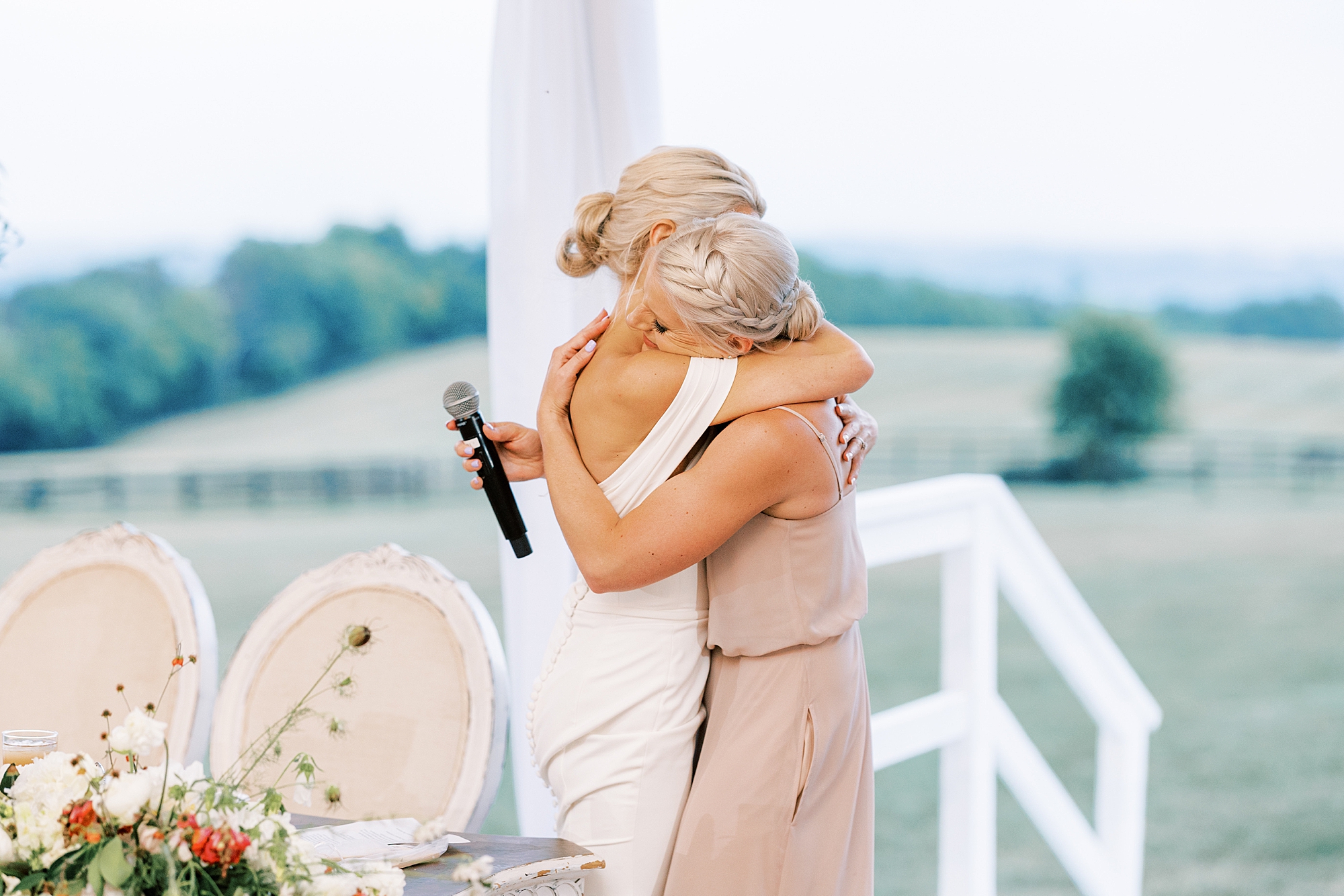 bridesmaid hugs bride after speech at Wrightsville PA Wedding reception