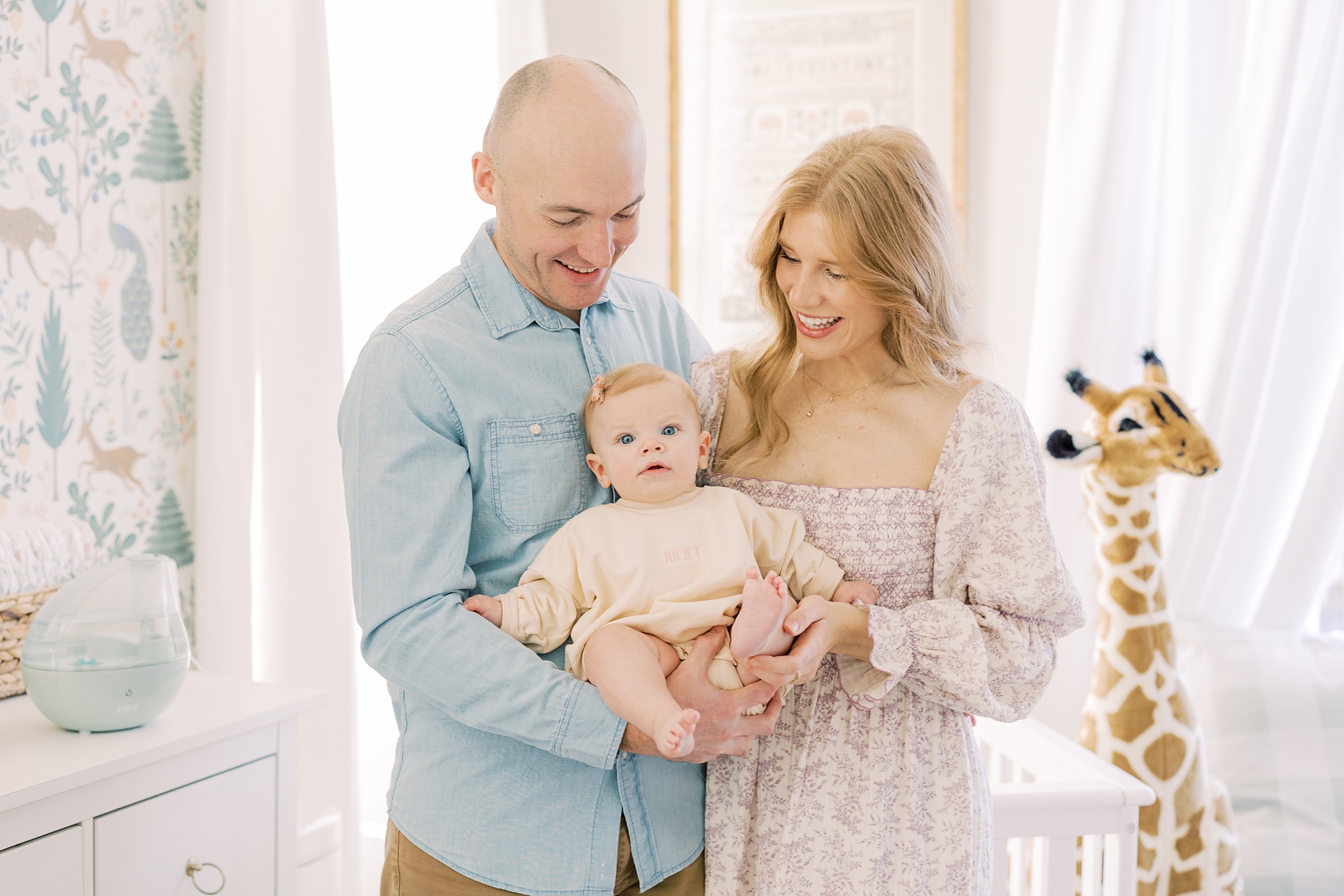 parents hold toddler during lifestyle milestone portraits in Glen Mills, PA