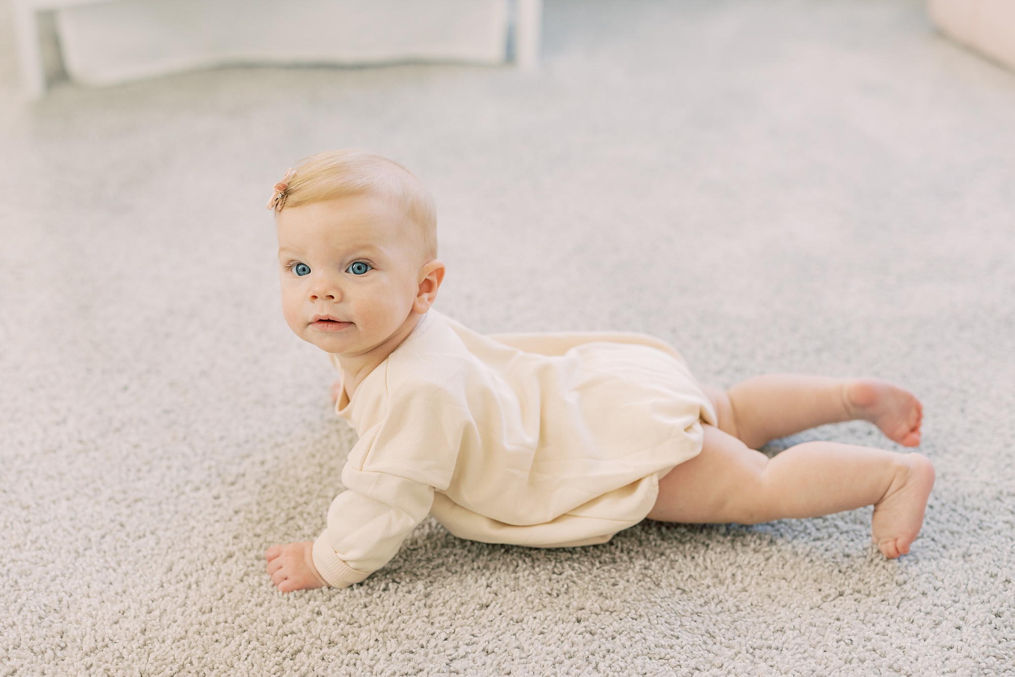 baby crawls on floor of nursery during Glen Mills PA lifestyle milestone portraits