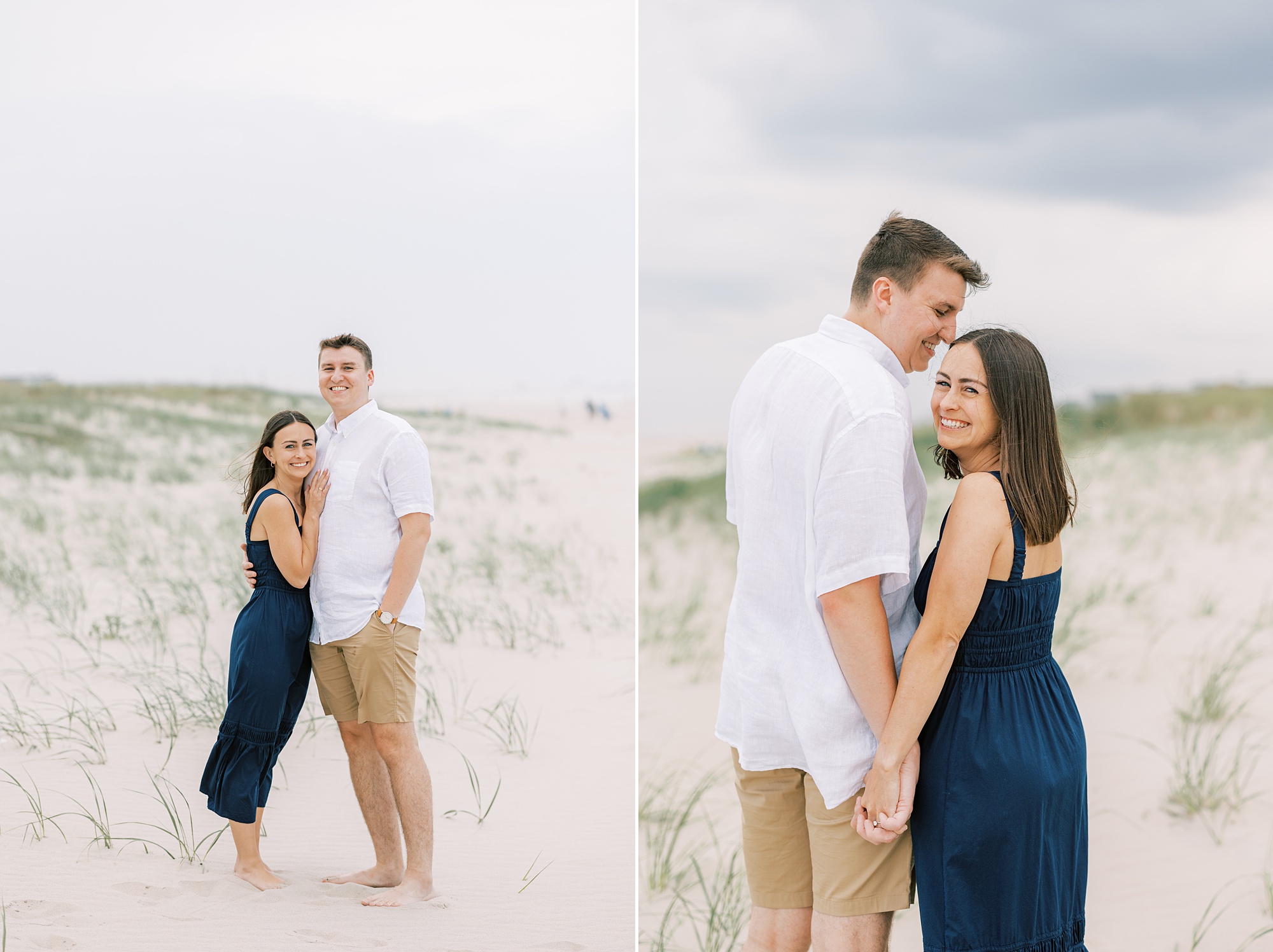 man looks down at woman holding hands near sand dunes in New Jersey 