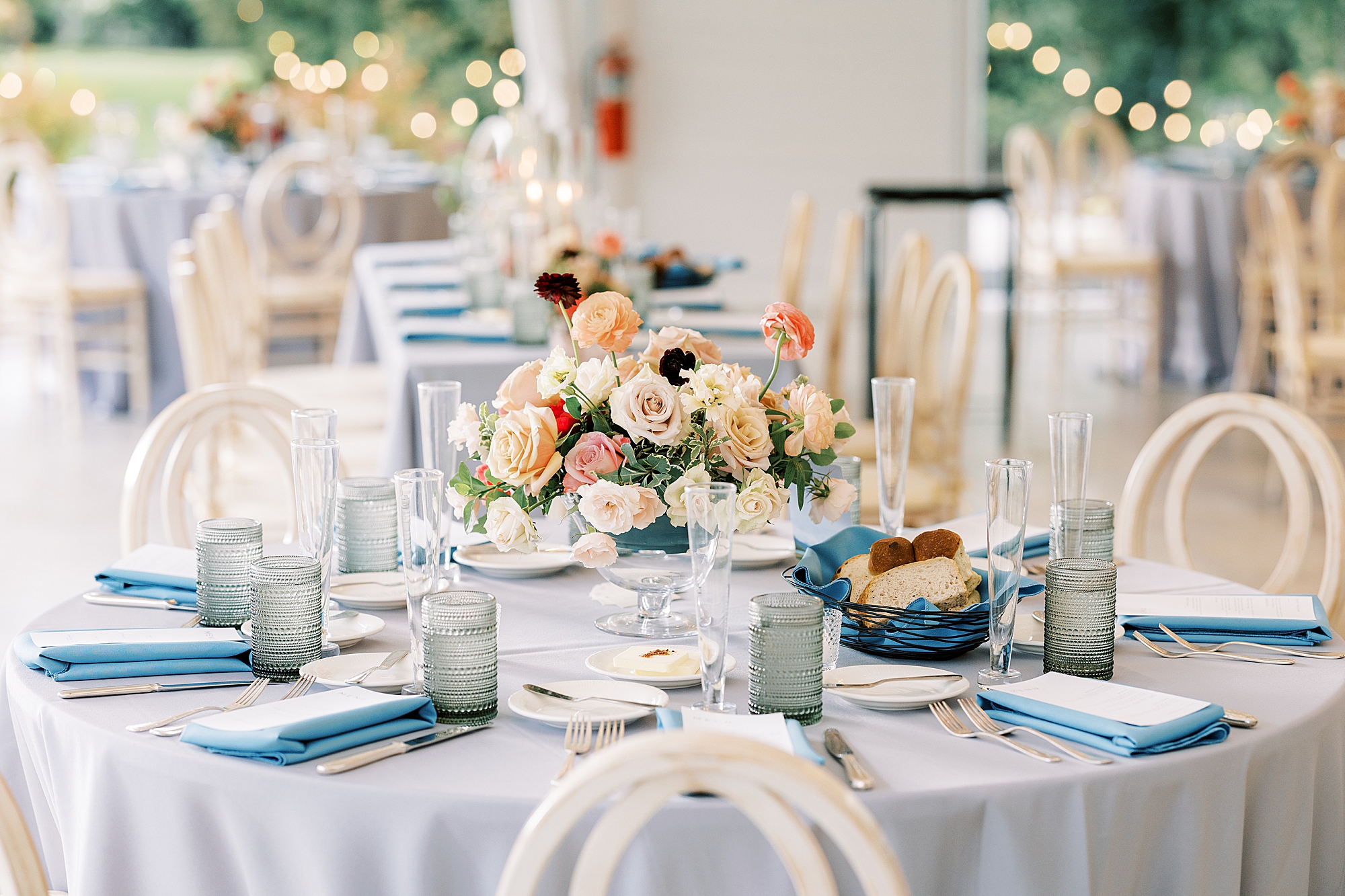 summer reception with pastel flowers and place settings 