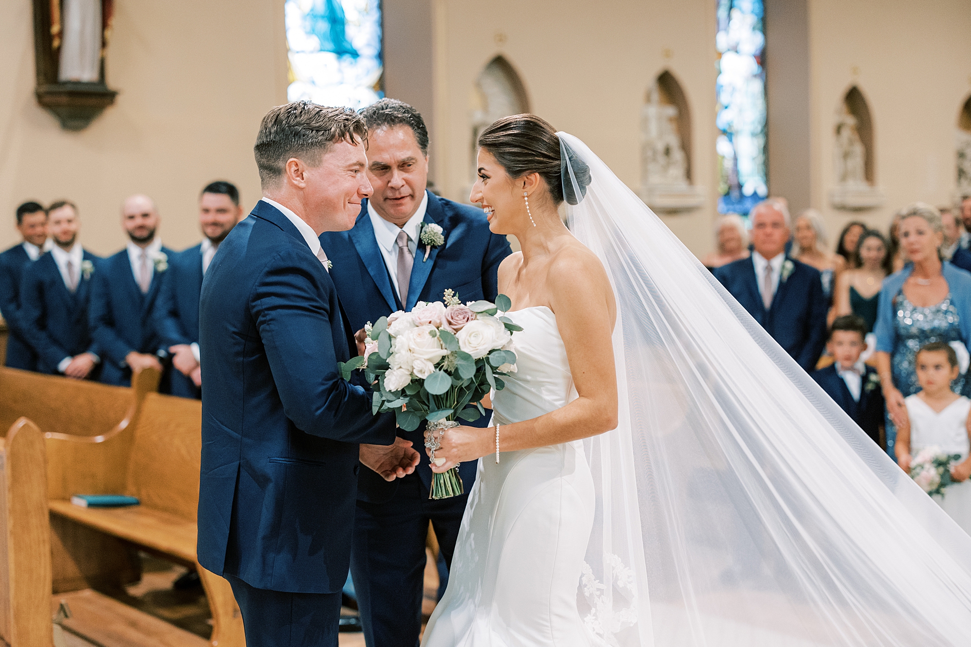 father gives away bride during traditional wedding ceremony at Philadelphia PA church