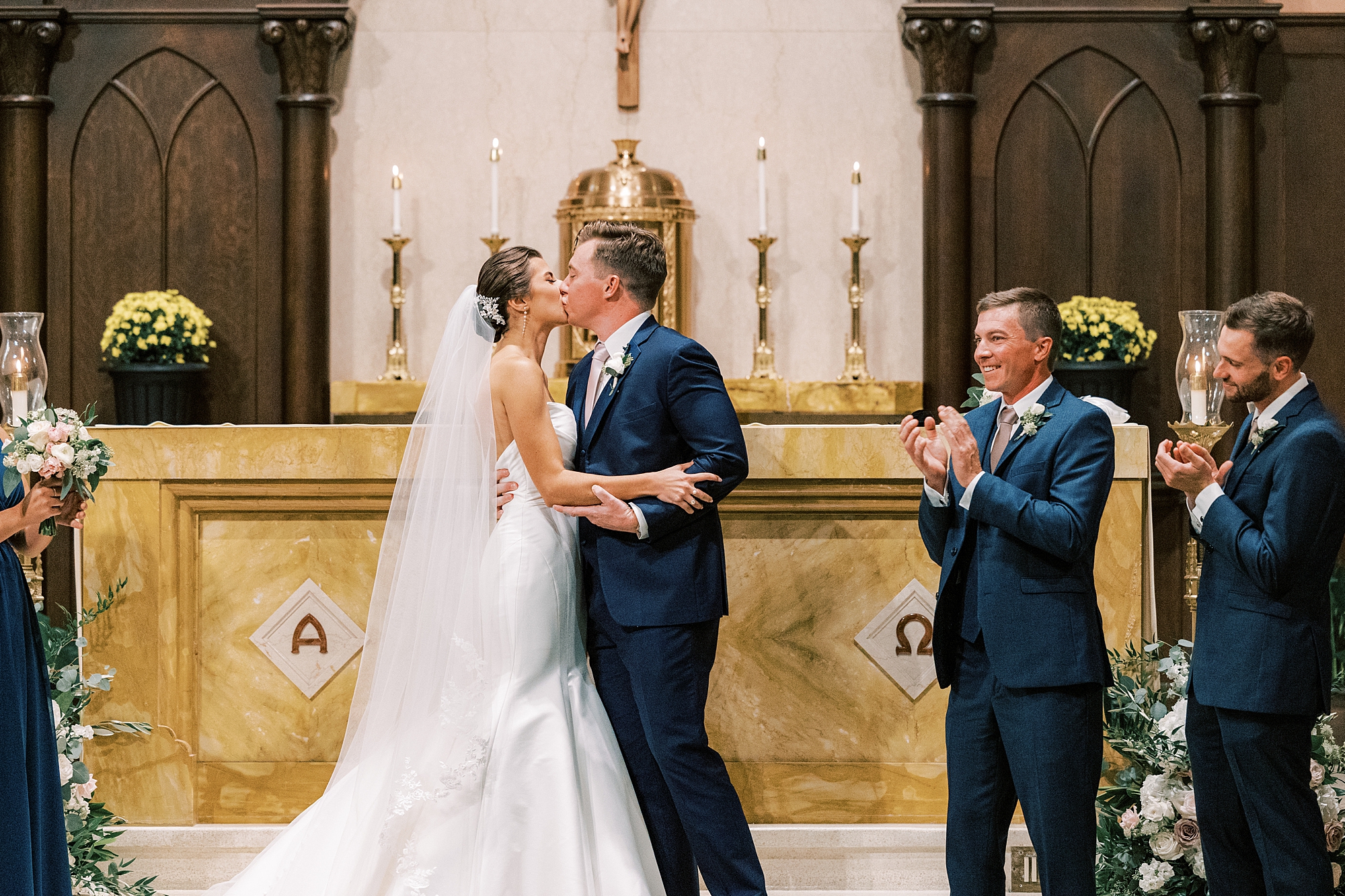 bride and groom kiss at the end of a traditional wedding ceremony at Philadelphia PA church