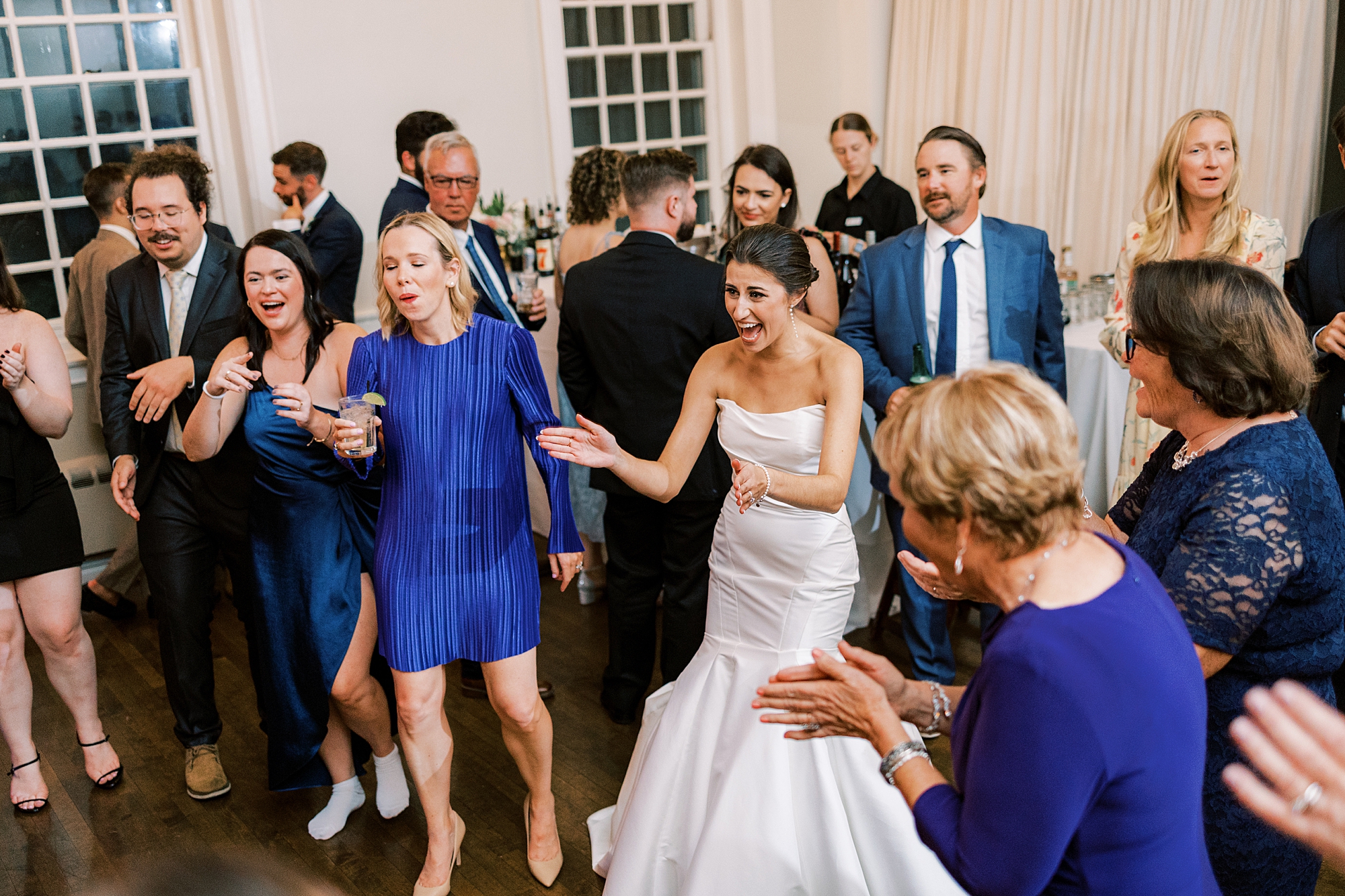 bride dances with guests during reception at the Philadelphia Cricket Club