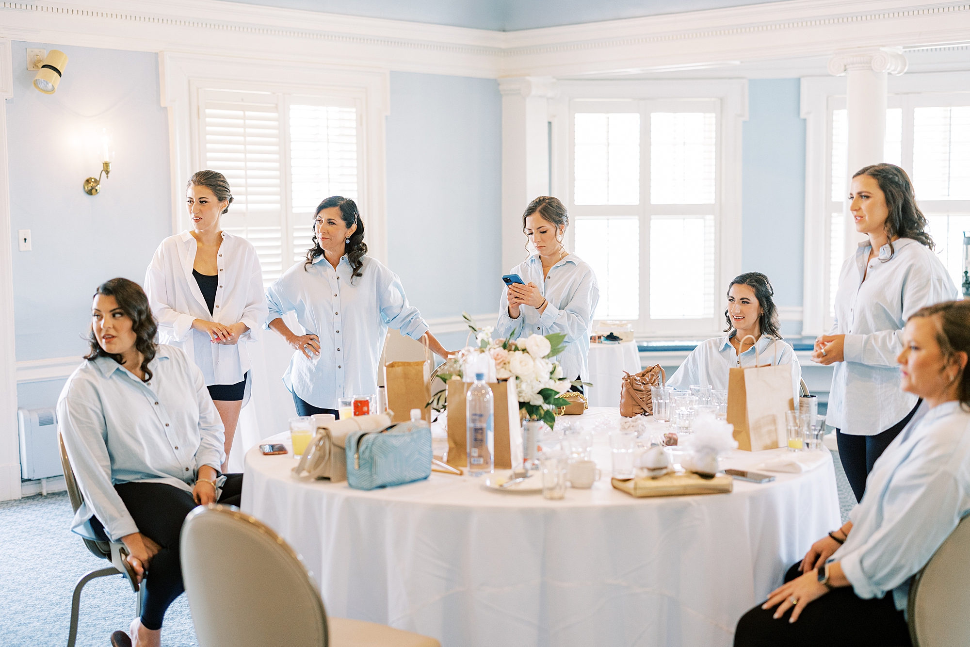 bride and bridesmaids eat breakfast together for Philly PA wedding day