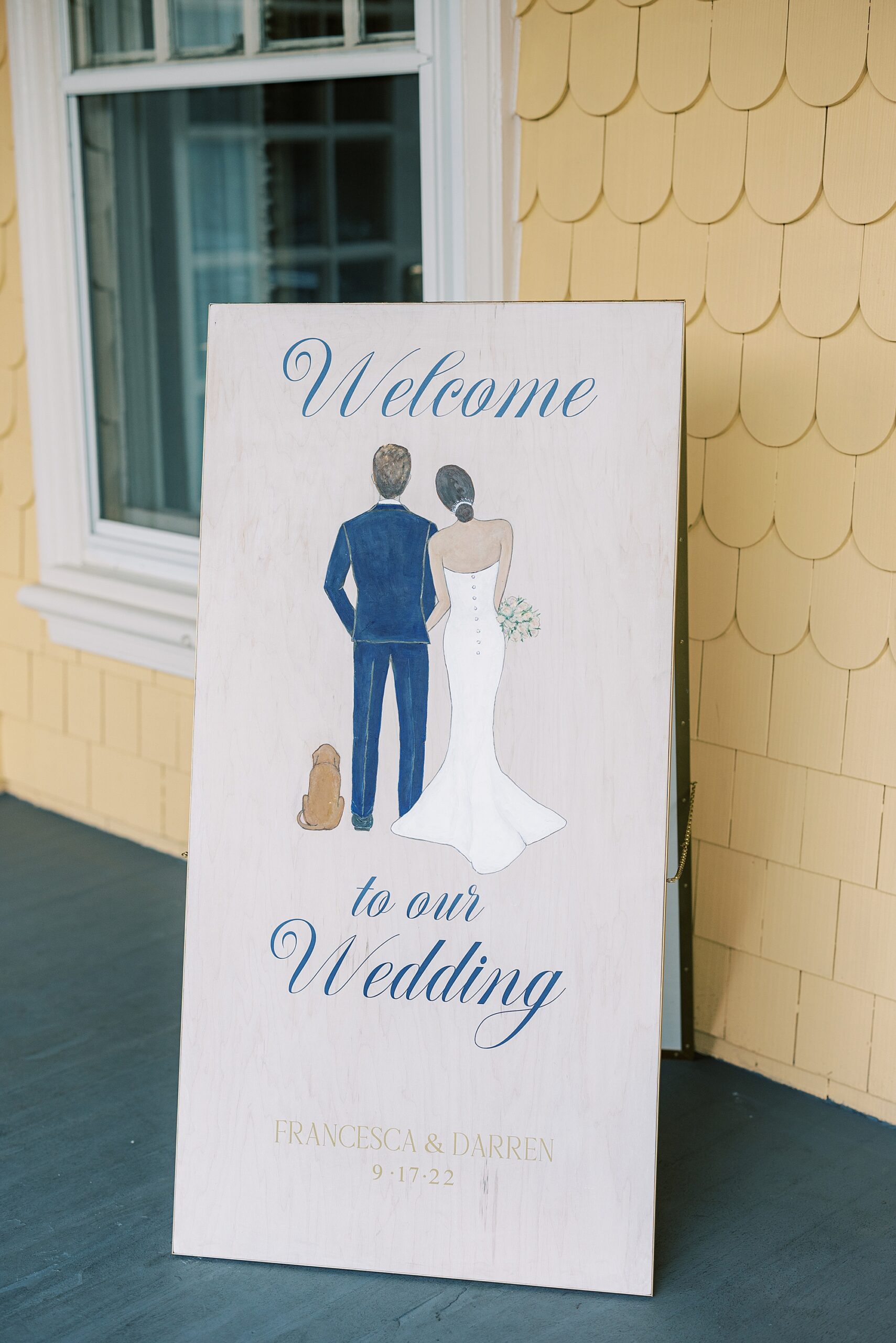 custom sign outside the Philadelphia Cricket Club wedding reception with drawing of couple and dog 