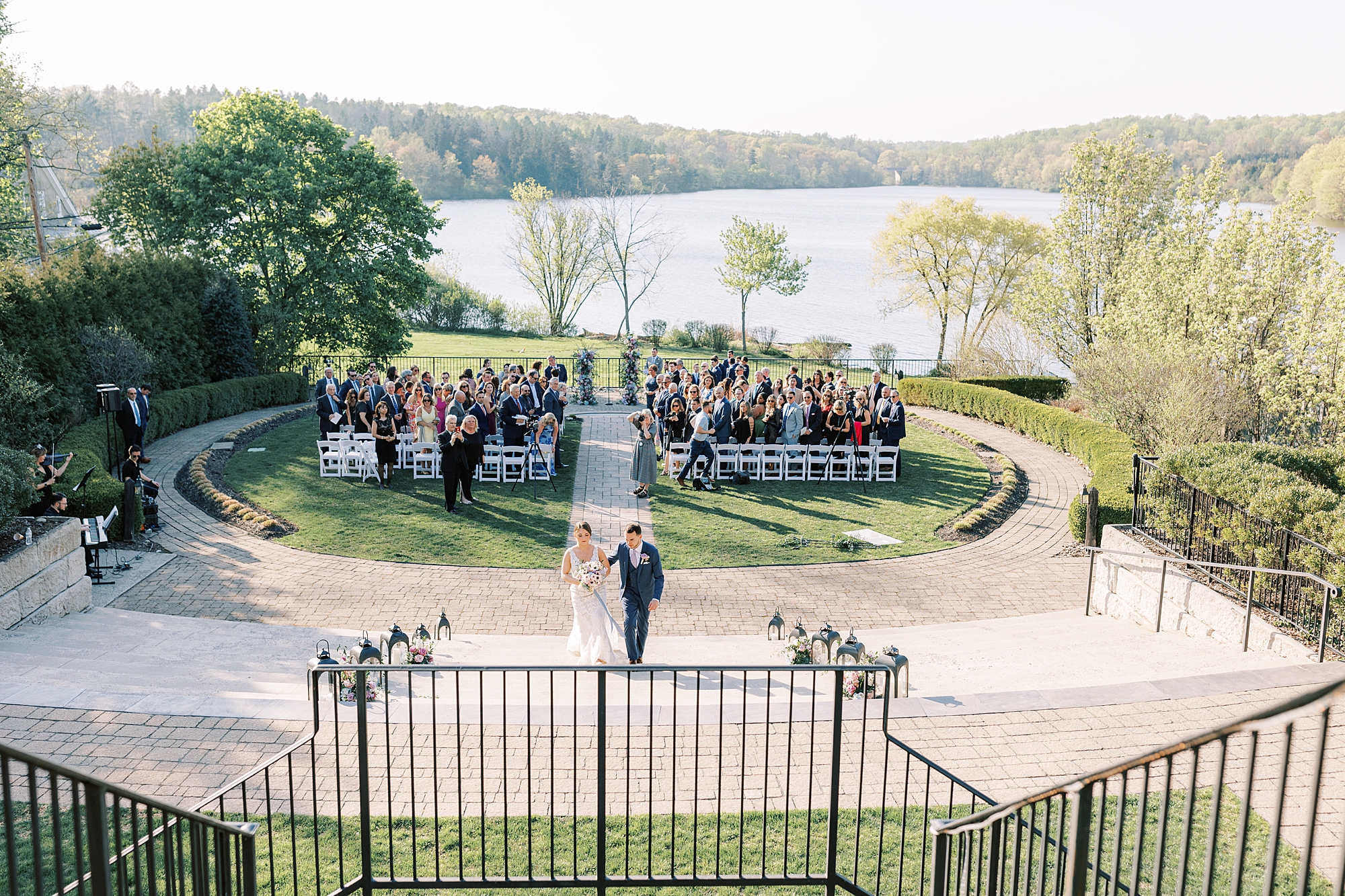 newlyweds leave wedding in gardens of Lake House Inn