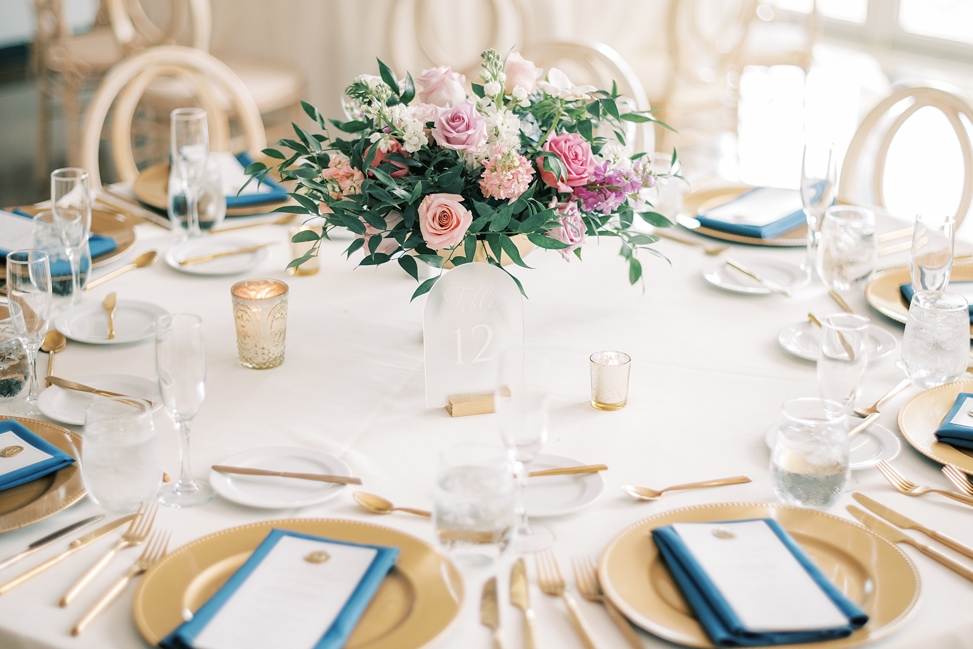 pink, purple, and white flowers centerpieces at Lake House Inn