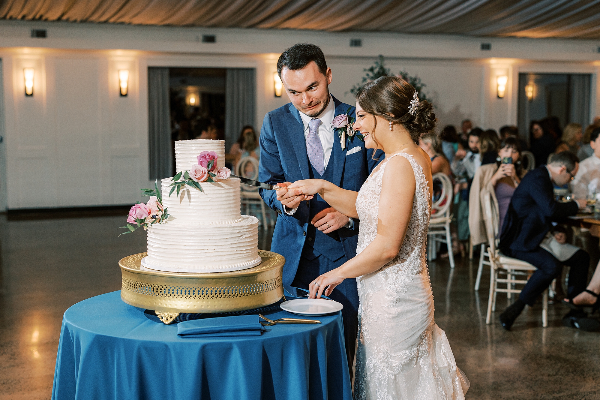 newlyweds cut cake during Perkasie PA wedding reception 