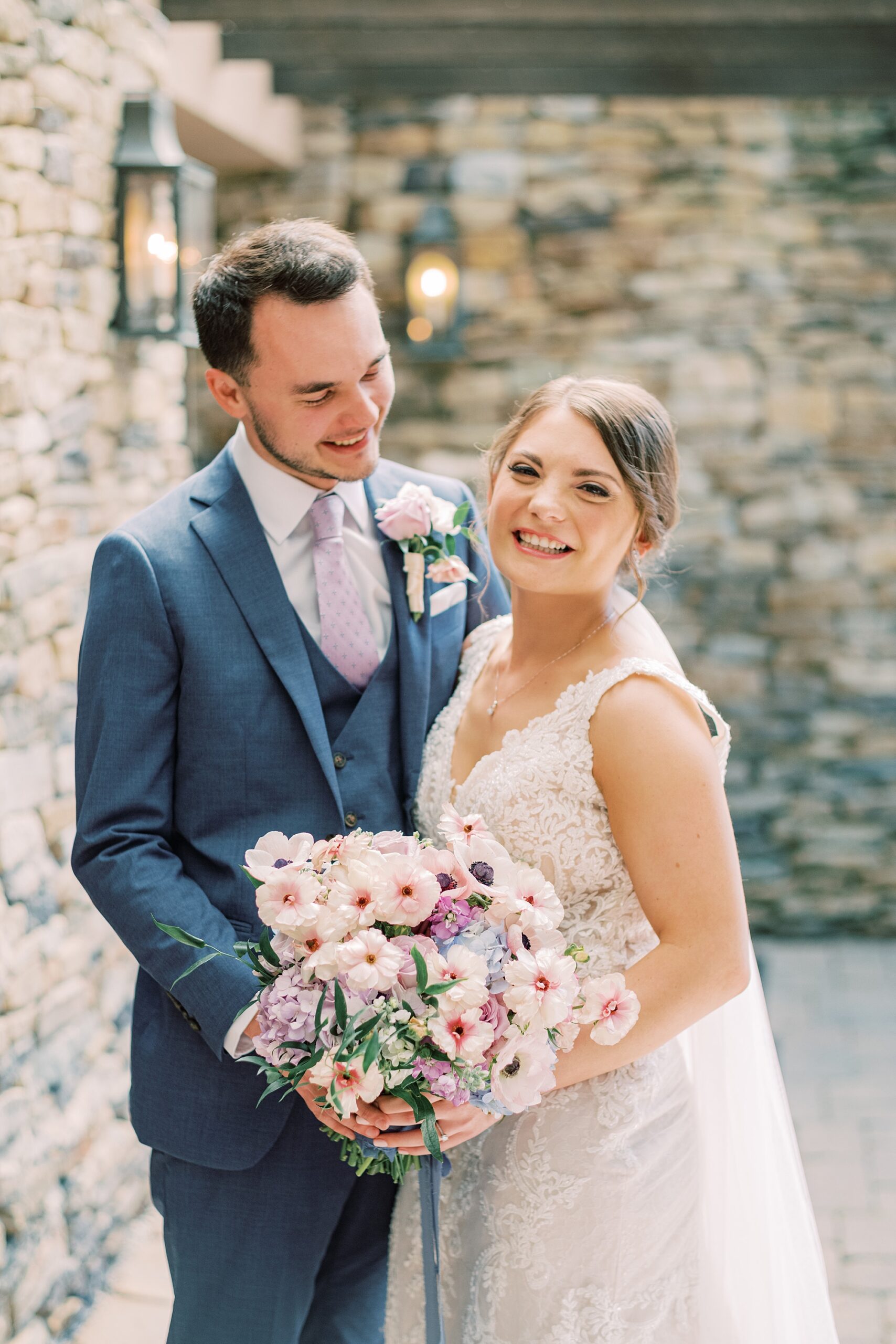 groom looks down at bride smiling during PA wedding photos 