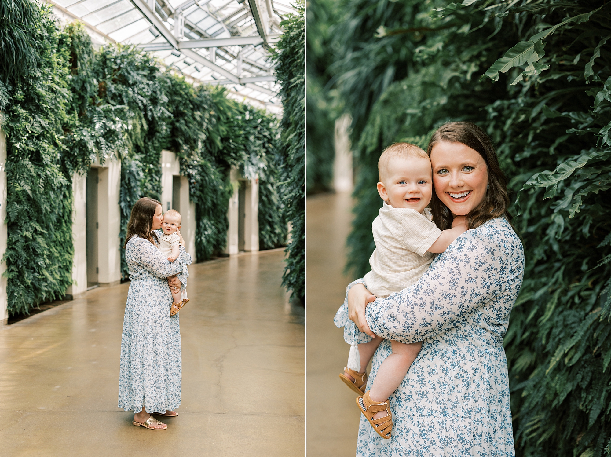 mom in blue and white dress holds toddler son in front of columns and ivy