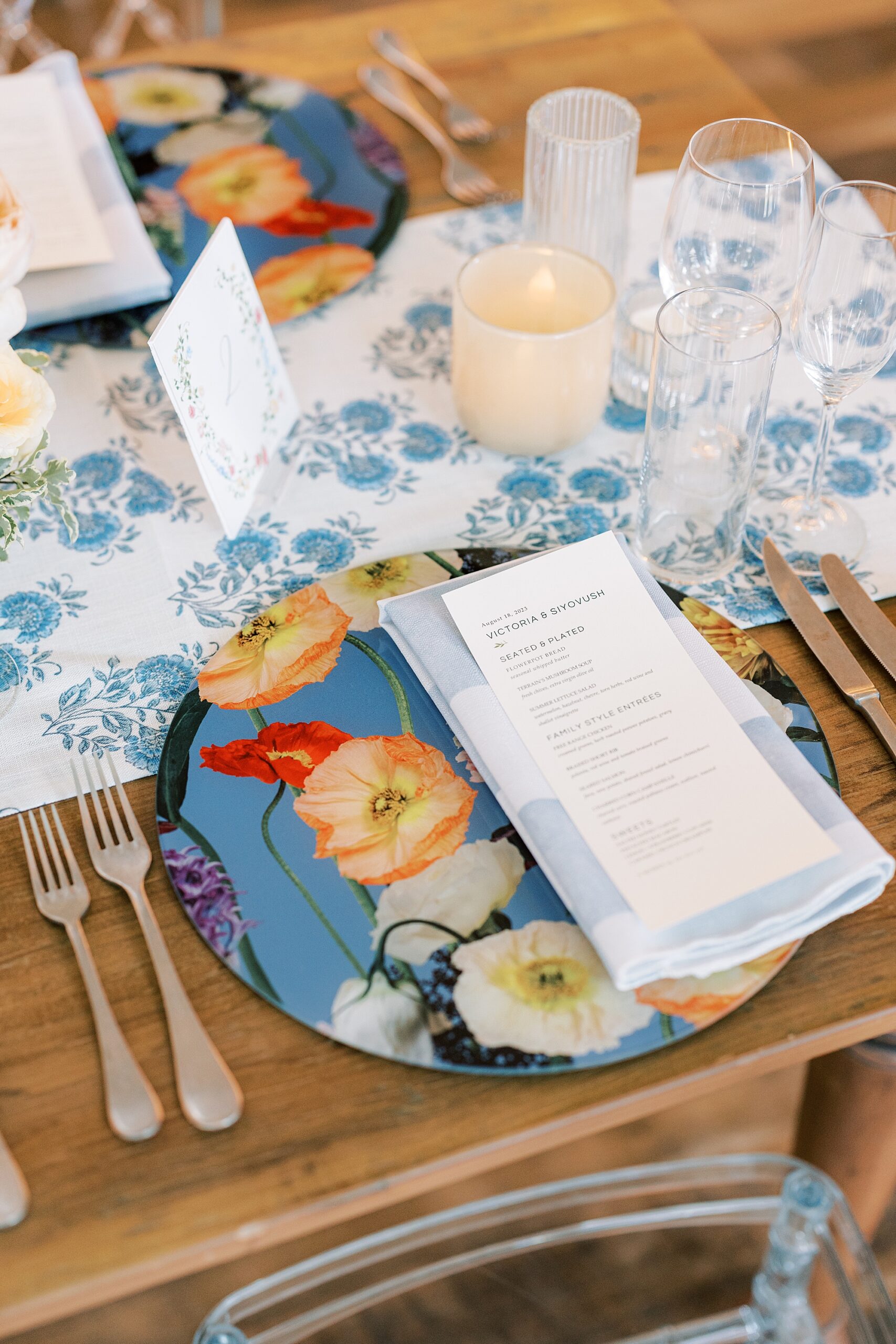 place setting with menu card on blue napkin at Terrain Gardens