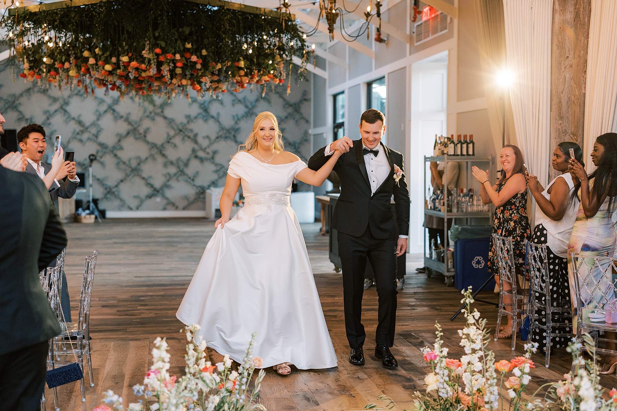 bride and groom walk onto dance floor at Terrain Gardens