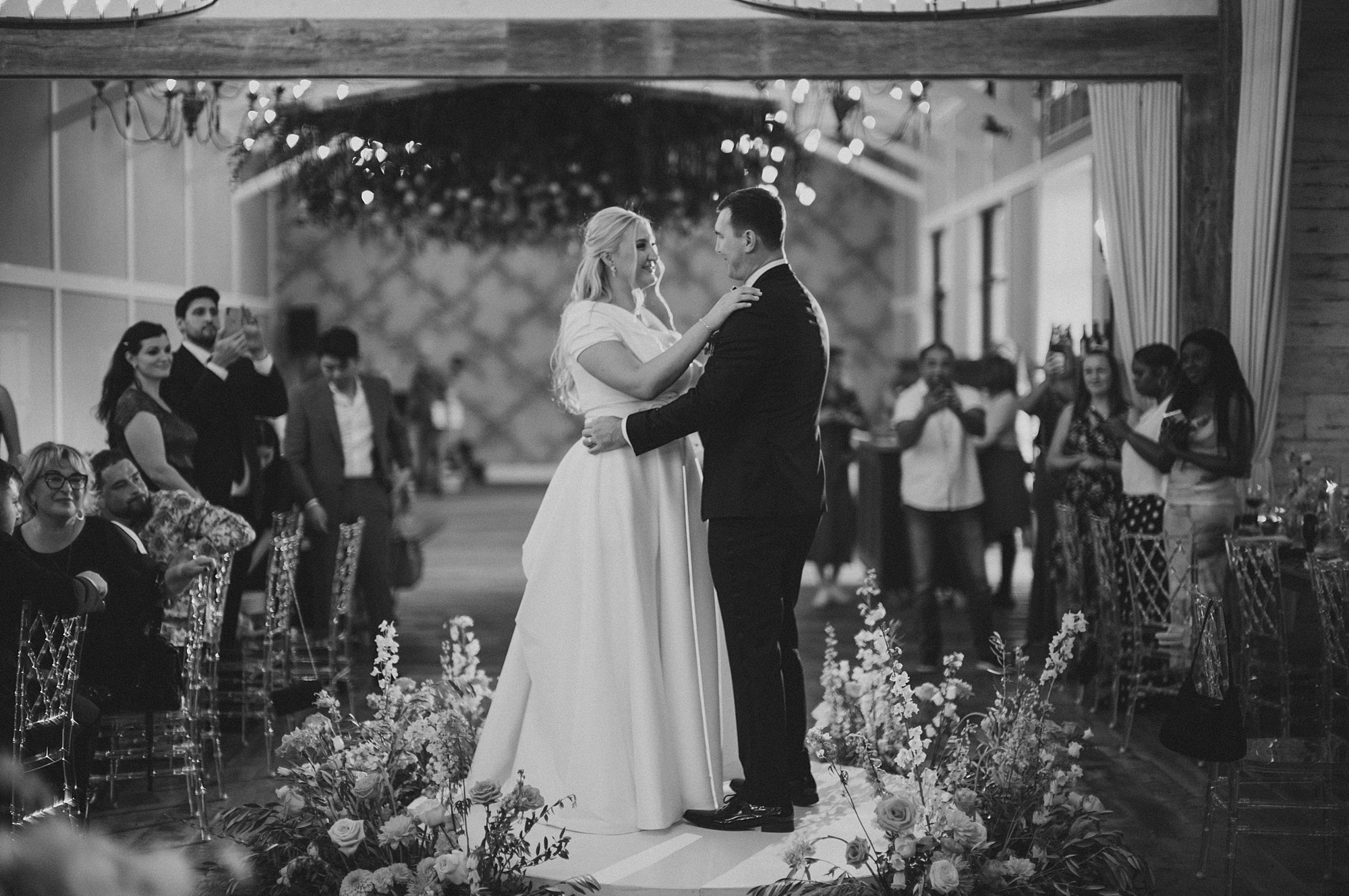 bride and groom dance together during Terrain Gardens wedding reception 