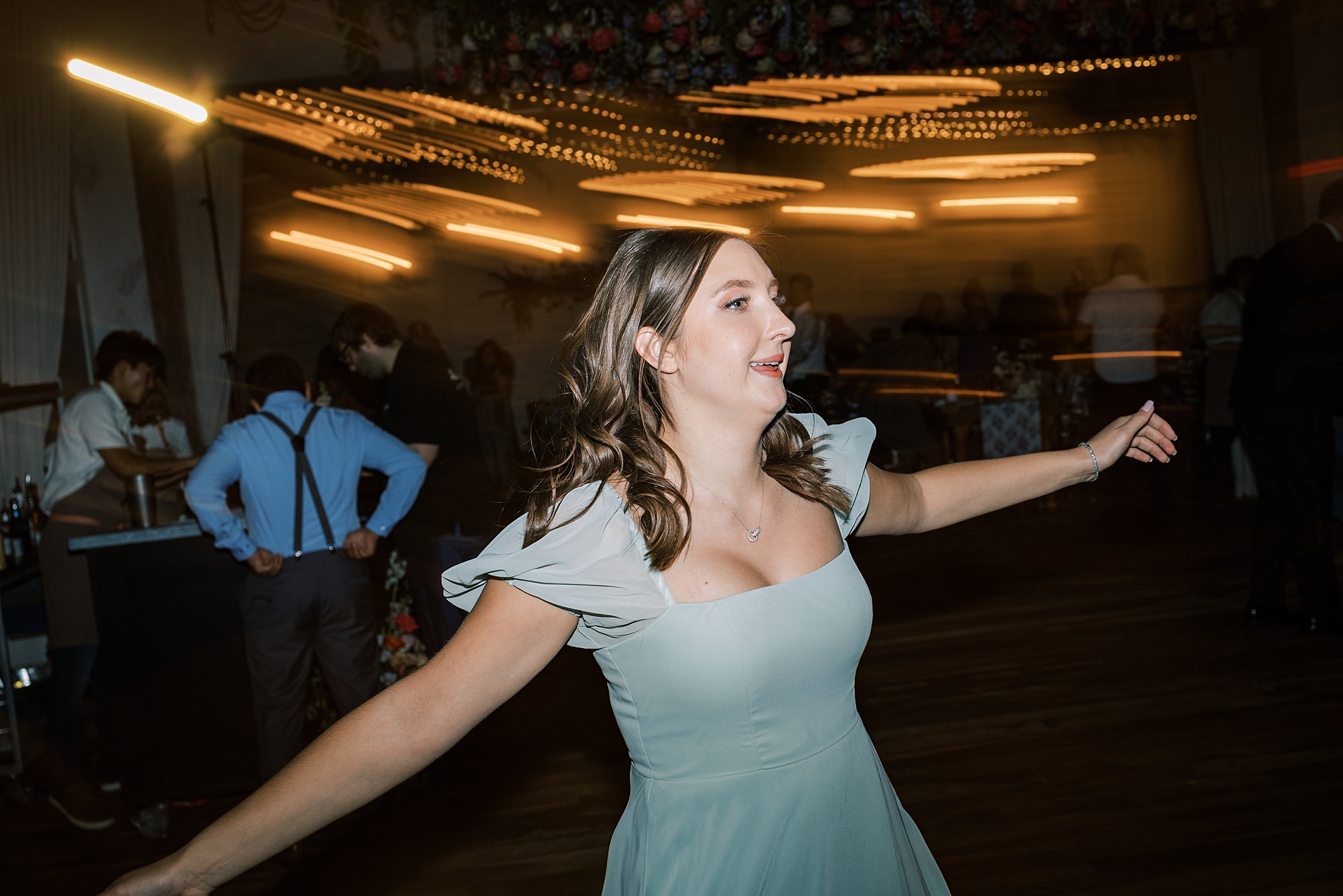 bridesmaid dances during Terrain Gardens wedding reception