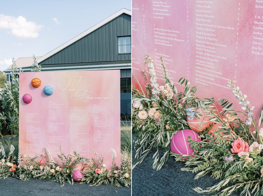 tall pink seating chart with balloons and flowers on bottom