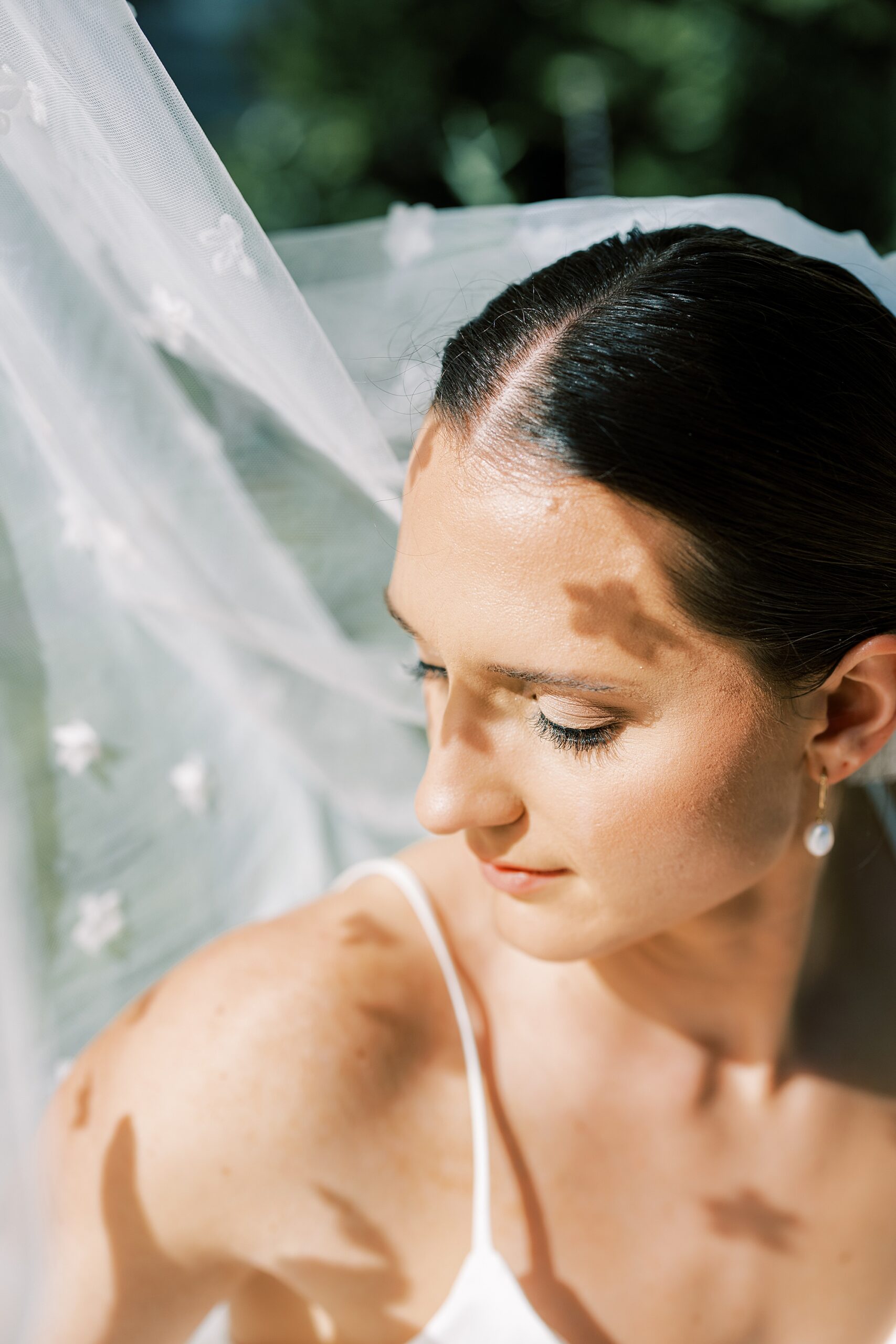 bridal portrait with veil in the air at Fairville Inn in Chadds Ford