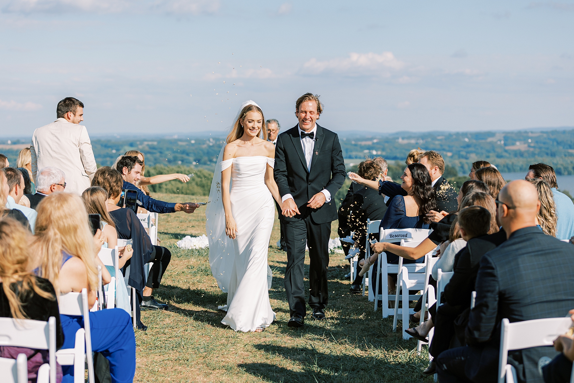 bride and groom walk up aisle at Lauxmont Farms after wedding ceremony 