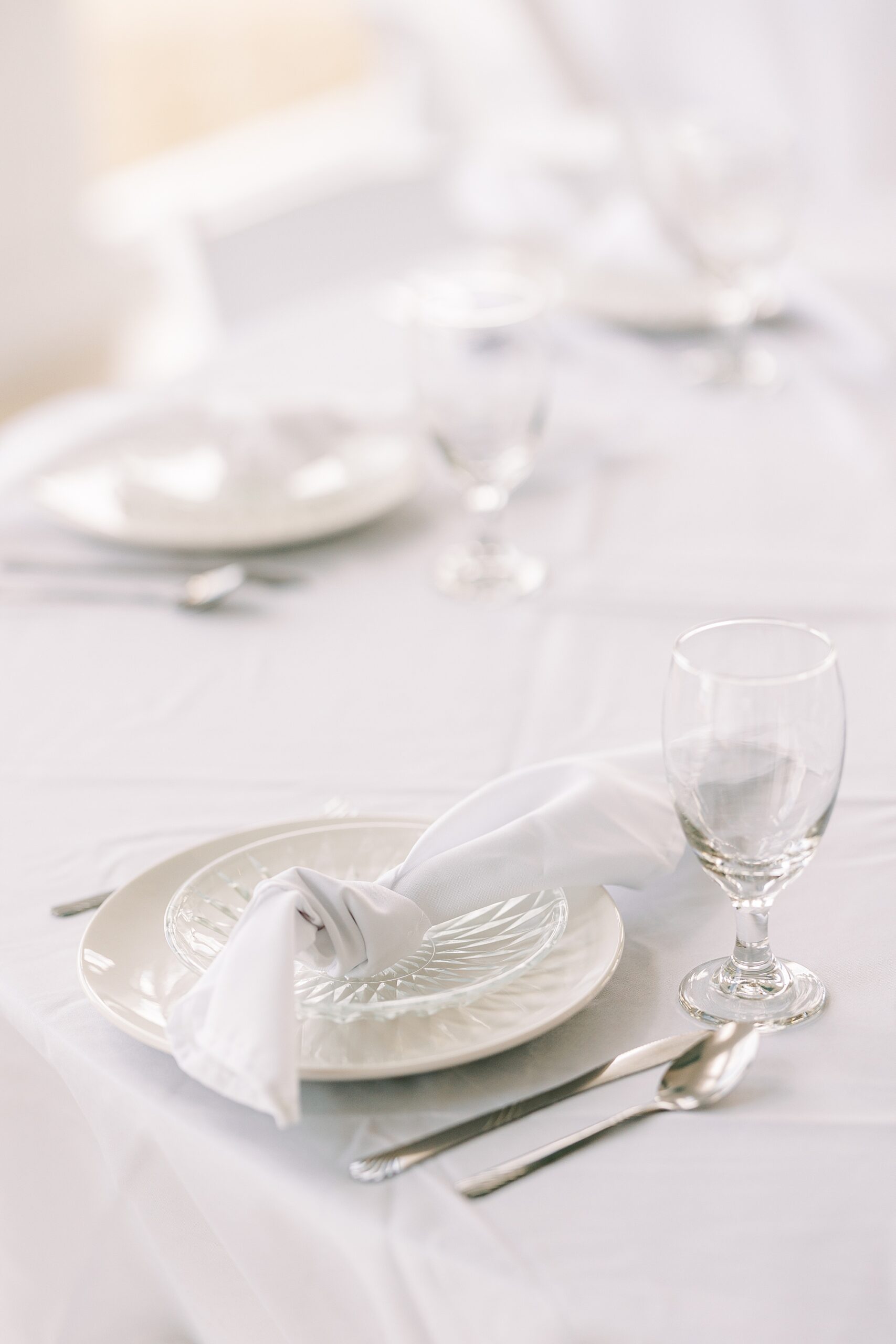 place setting with white napkins and silverware at Lauxmont Farms