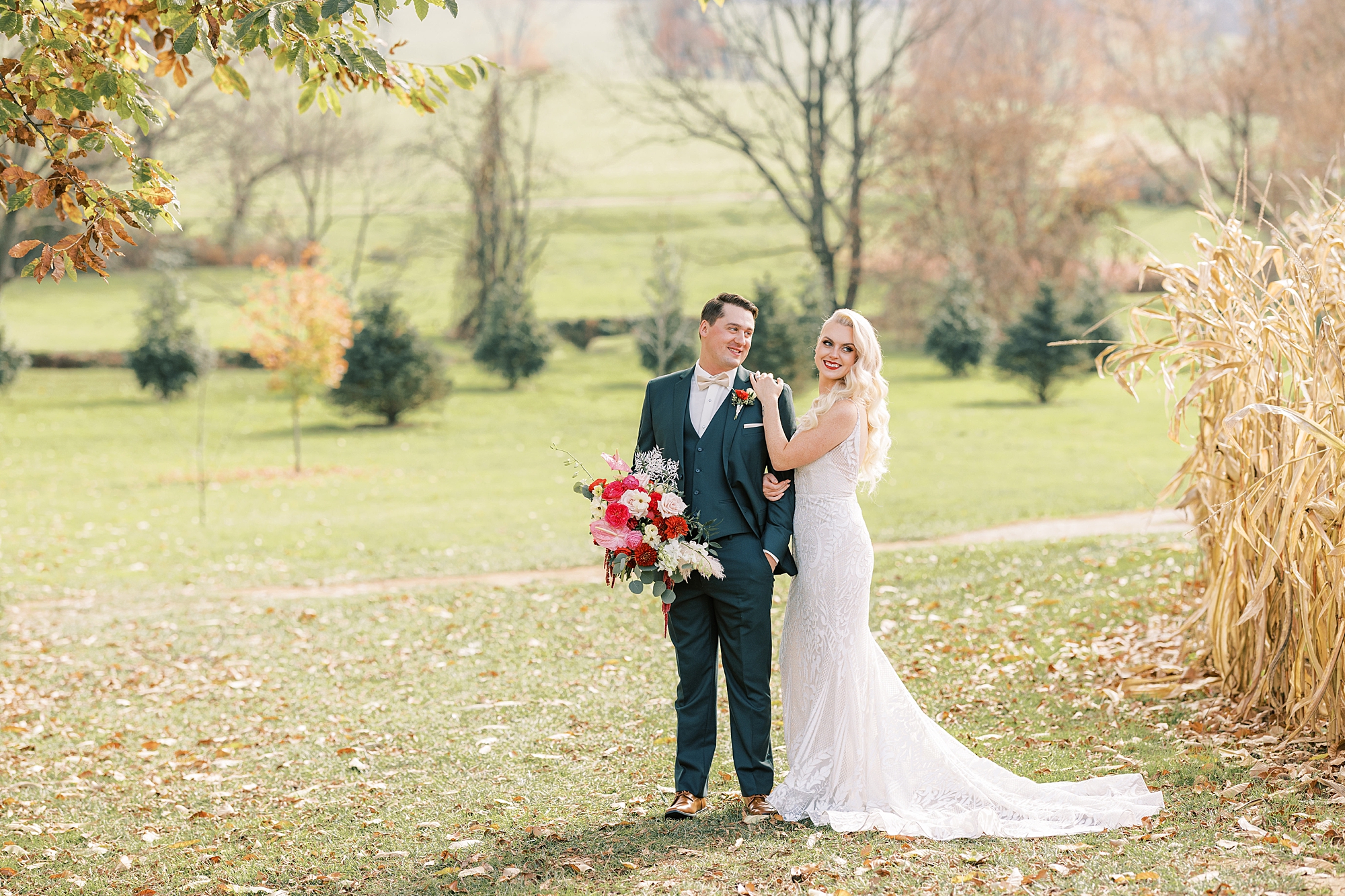 bride and groom hug in field at Osbornia Farm