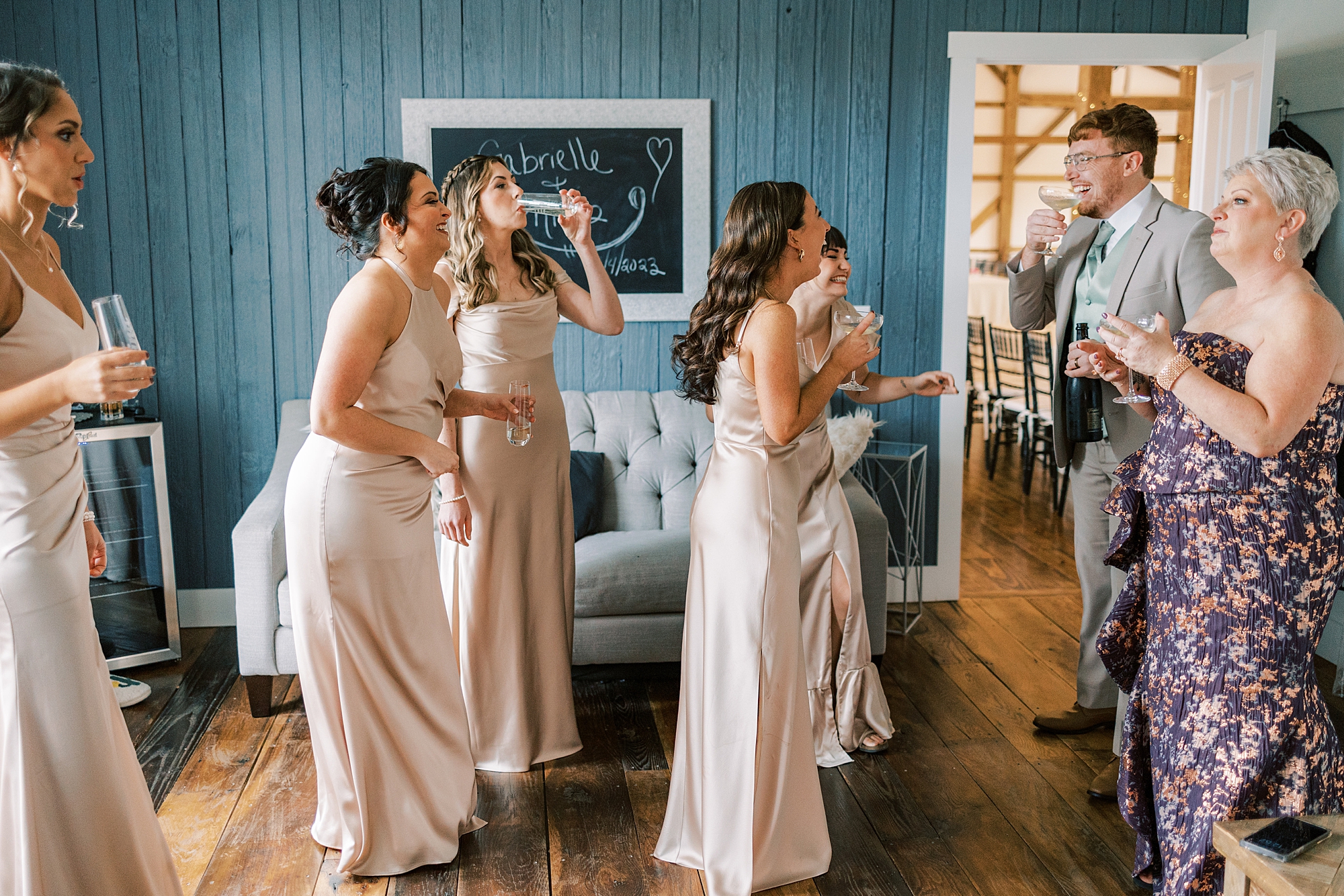 bridesmaids react to seeing bride in wedding dress