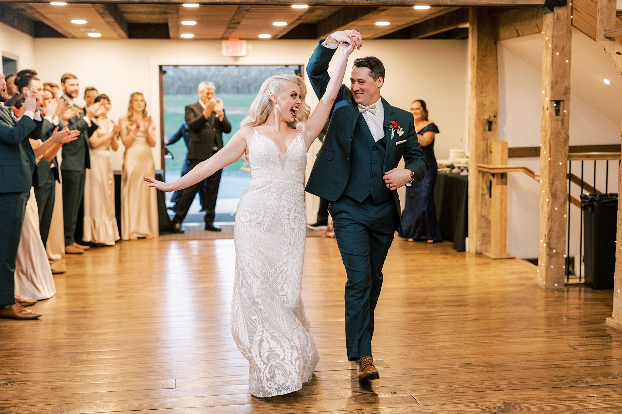 bride and groom enter wedding reception at Osbornia Farm