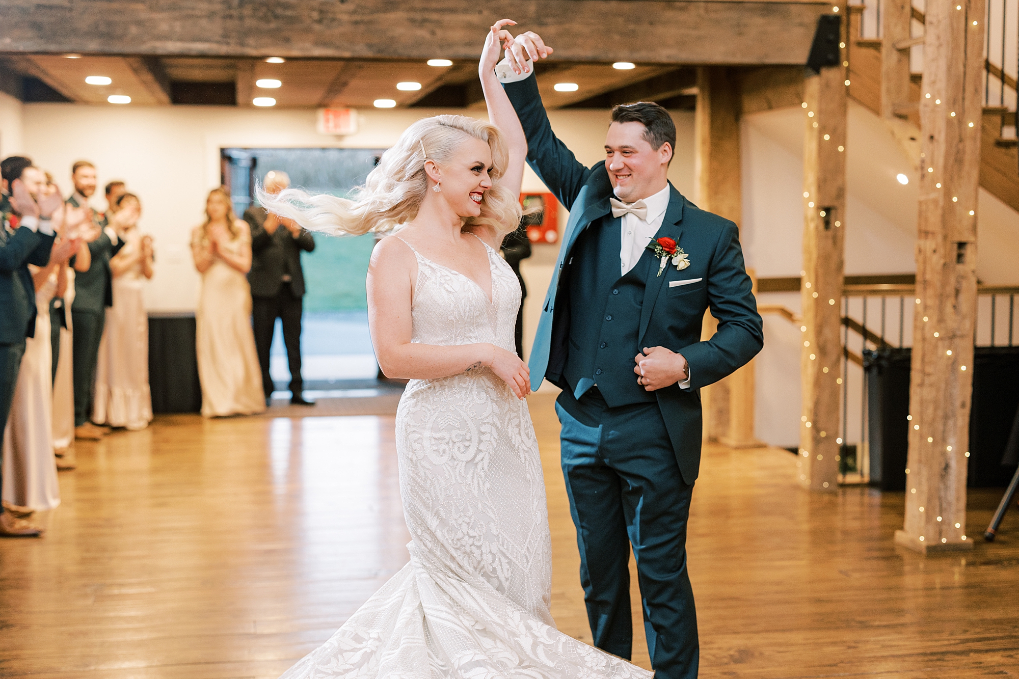 groom twirls bride during wedding reception in Lancaster PA