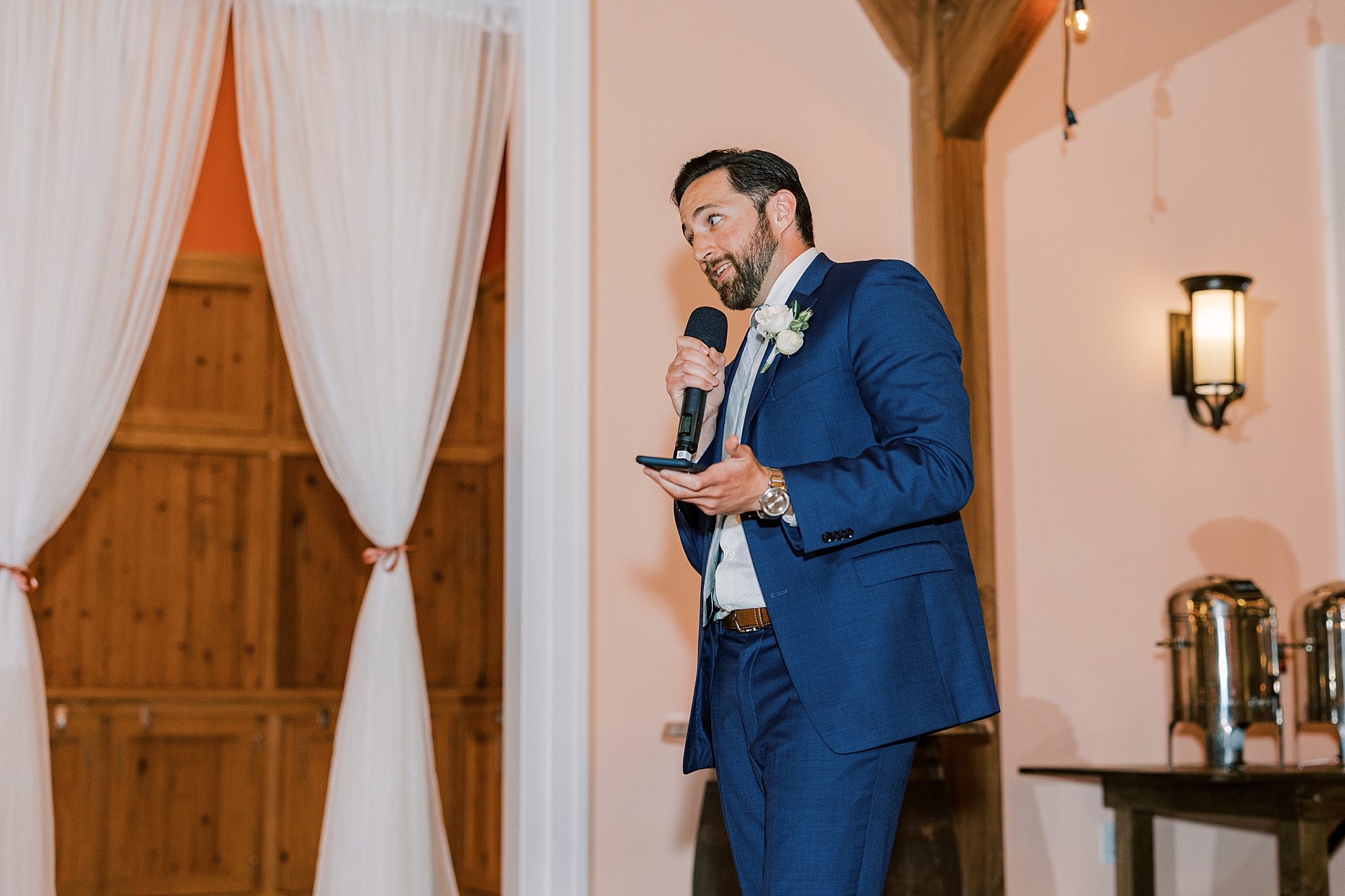 groomsman gives speech during Willow Creek Winery wedding reception