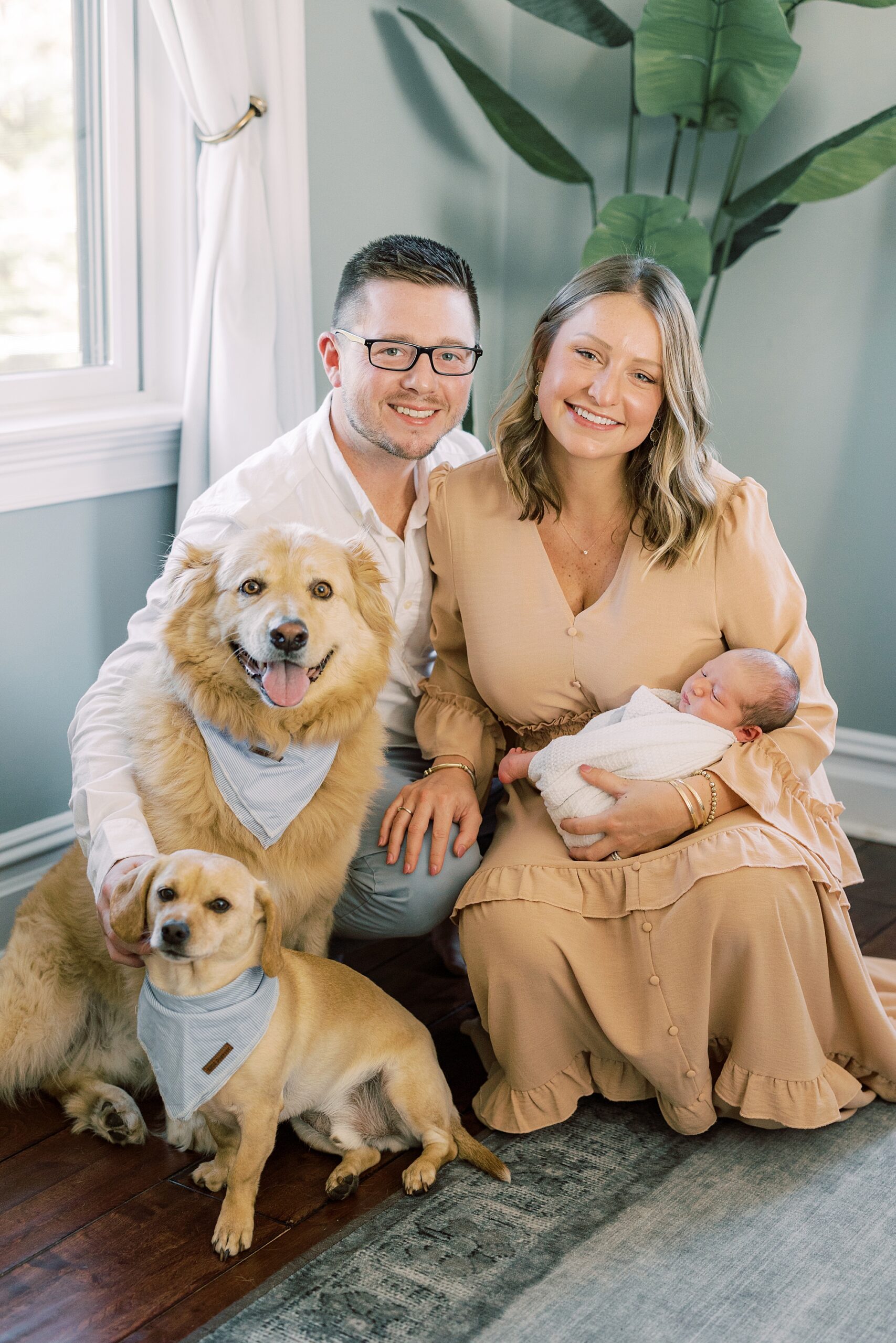 parents pose with new son and two dogs during Chadds Ford PA home