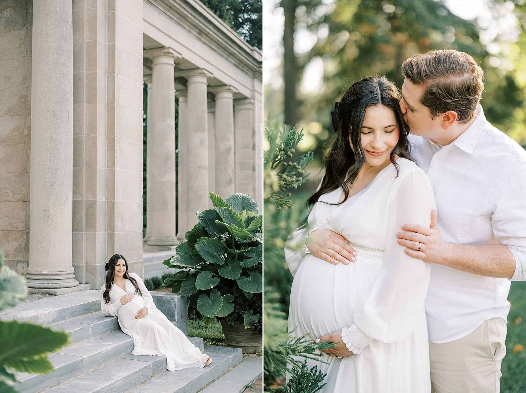 a pregnant woman in a white dress reclines on stone steps with a row of grand stone columns behind her in the Nemours Mansion and Gardens