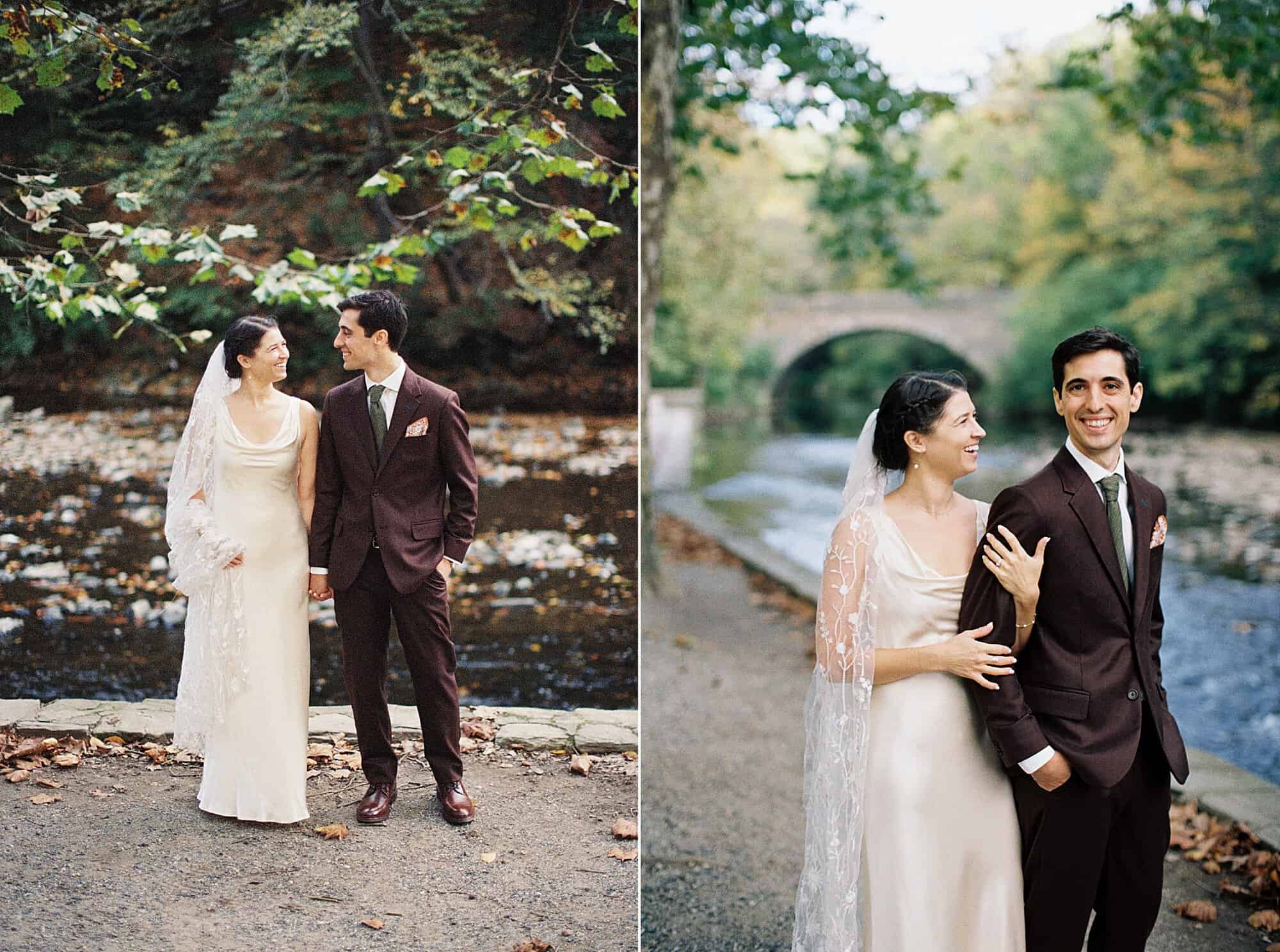 Close-up of a bride and groom embracing outdoors in Valley Green Inn's natural setting with soft focus on a stream and fallen leaves