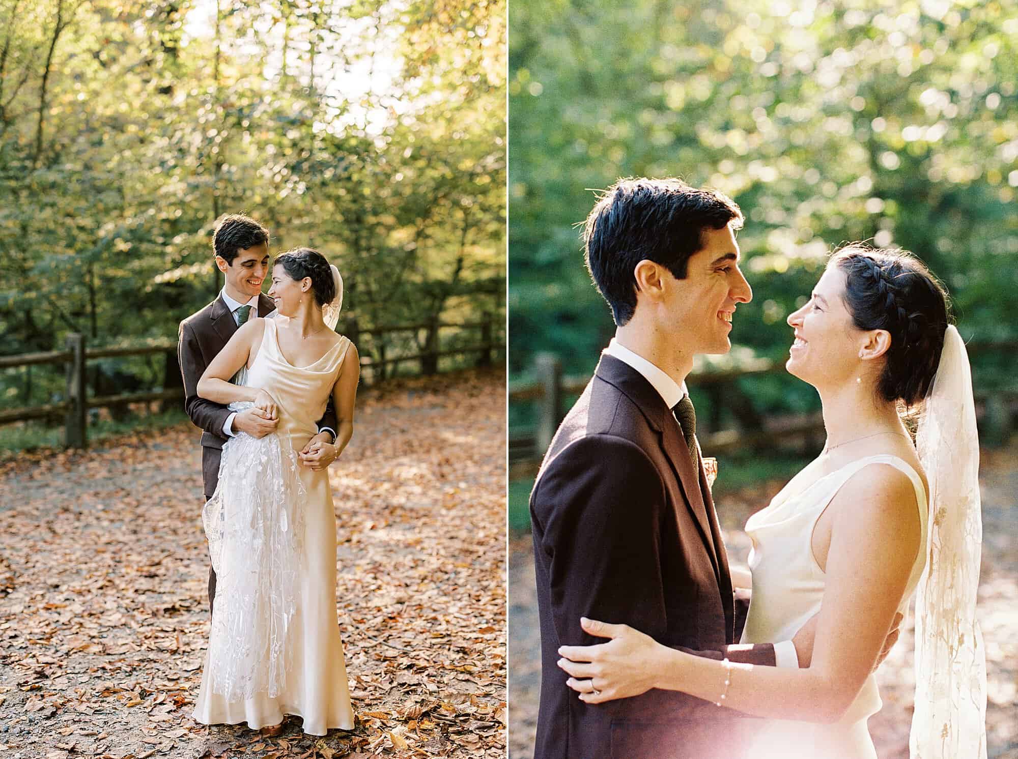 a bride and groom snuggle up to each other surrounded by fall leaves on their philadelphia wedding day