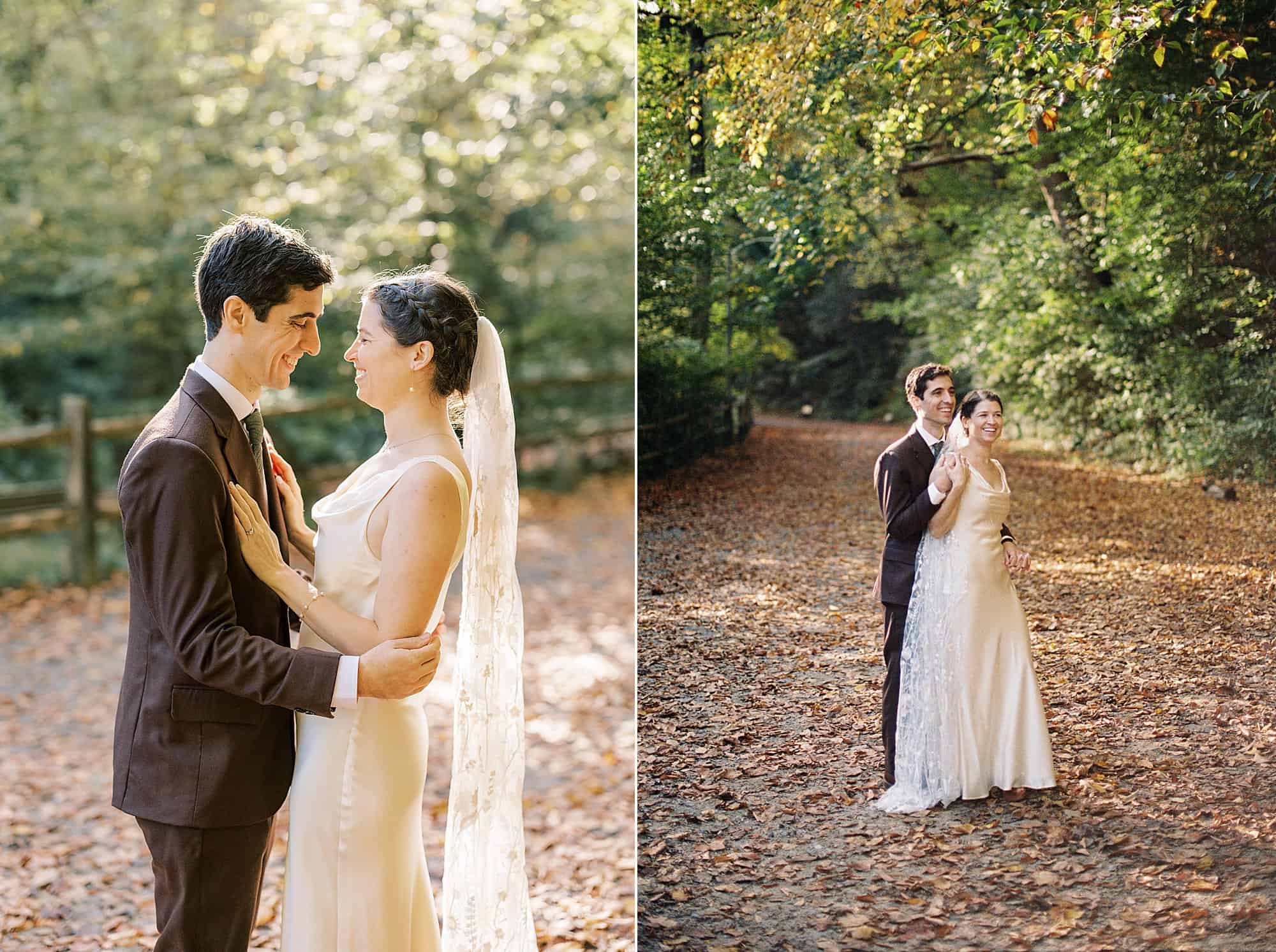 a bride and groom snuggle up to each other surrounded by fall leaves on their philadelphia wedding day at Valley Green Inn