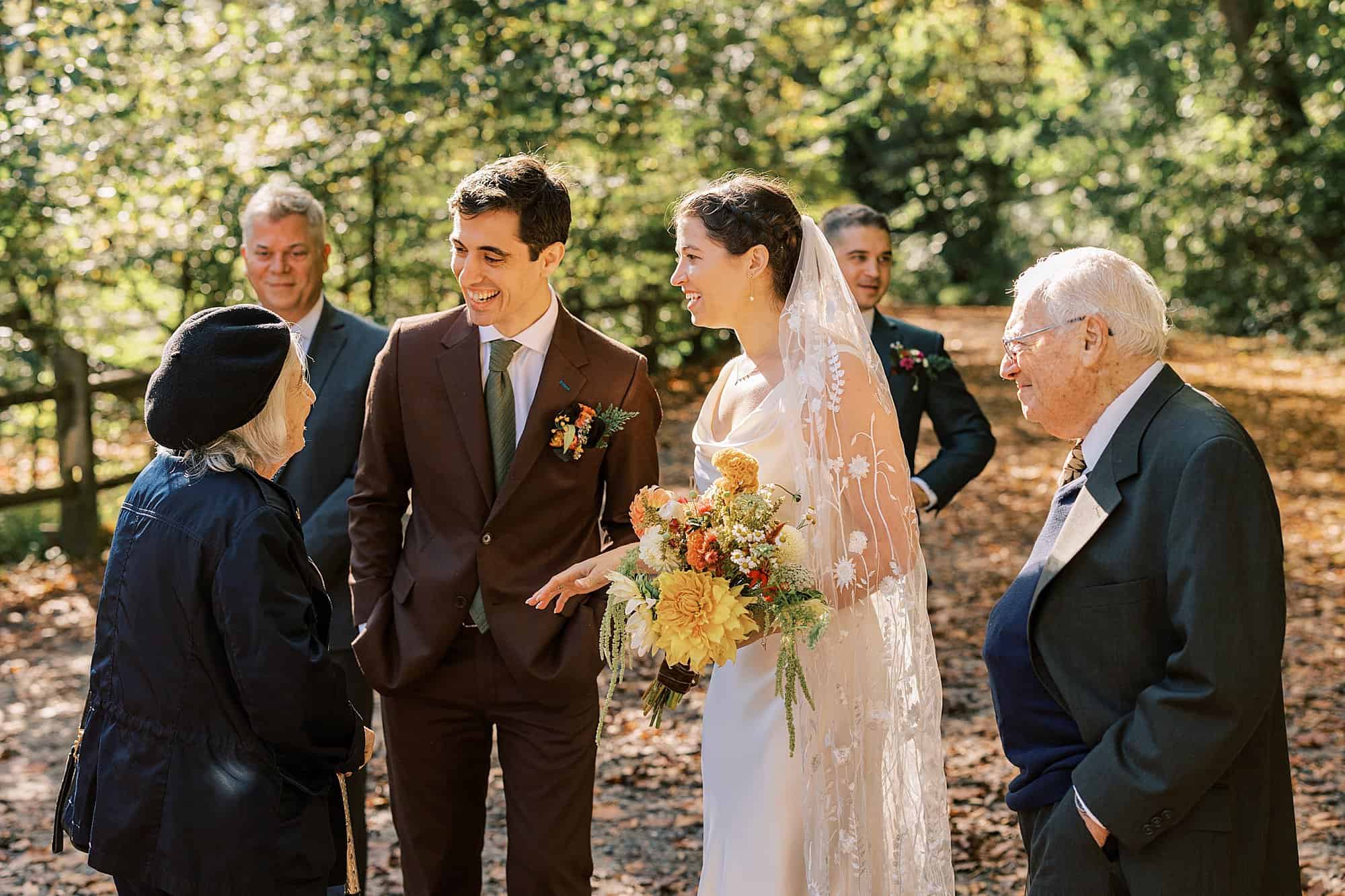 a bride and groom welcome the bride's grandmother with advanced Alzheimer's and her grandfather to the wedding