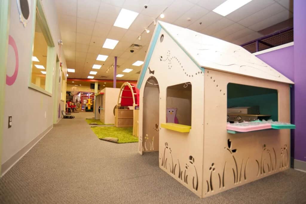 a wooden playhouse at the indoor playground The Little Pod in the Philadelphia suburbs