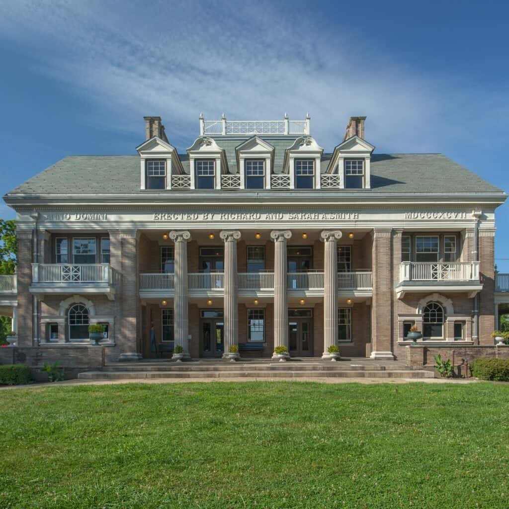 an exterior image of a beautiful old home with columns known as Smith Memorial Playground & Playhouse an indoor playground in Philadelphia