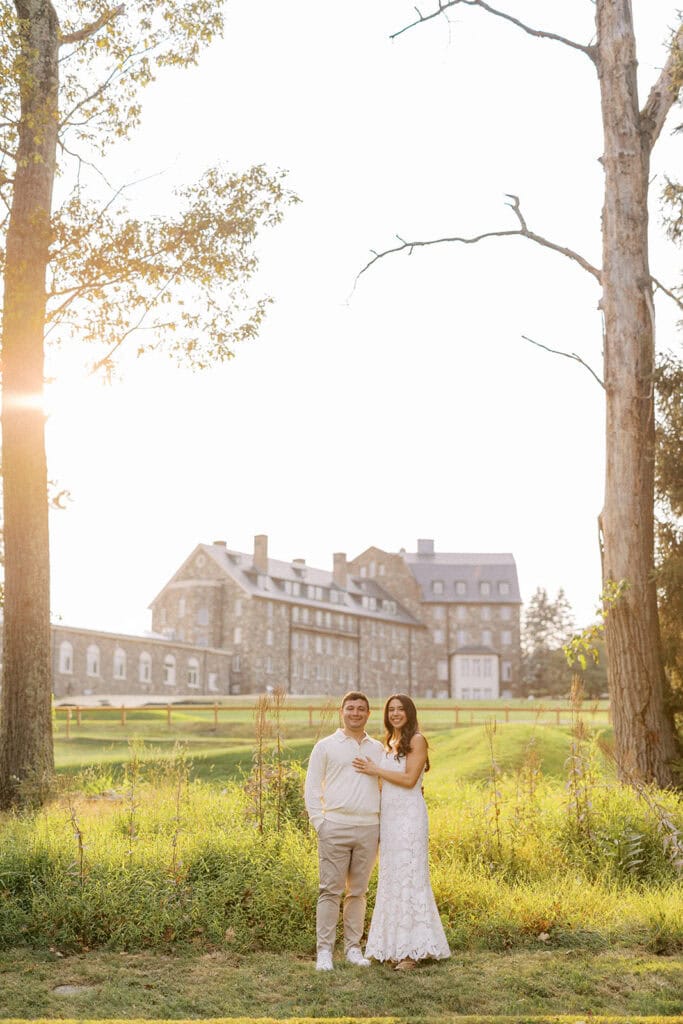 Bride and groom in rehearsal dinner attire during golden hour sunset portraits on the grounds of Skytop Lodge, PA during their wedding weekend at Skytop, photographed by Samantha Jay Photography