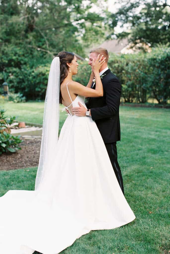 Bride and groom sharing a first look moment during their Rehoboth Beach wedding, captured on film by Samantha Jay Photo