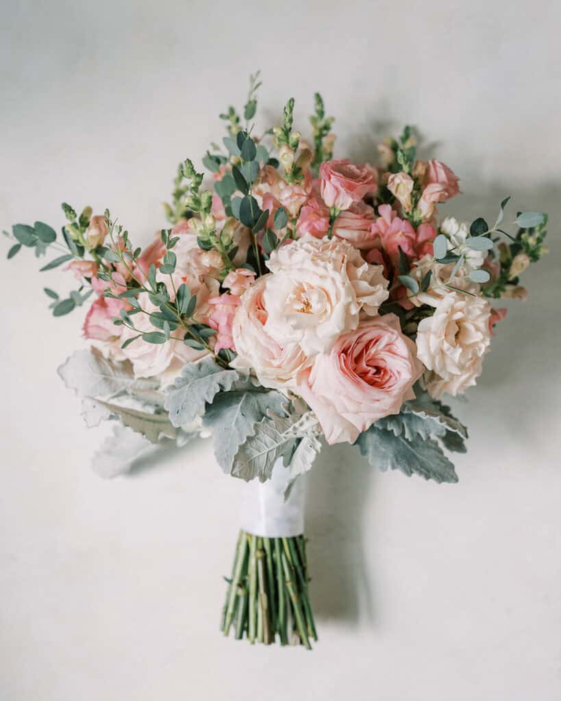 Blush and pink bridal bouquet with garden roses, snapdragons, and eucalyptus for Rehoboth Beach Delaware wedding