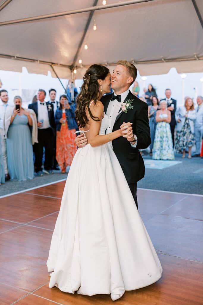 ride and groom first dance under string lights in wedding tent at Henlopen Acres Beach Club, Rehoboth Beach Delaware, Samantha Jay Photo