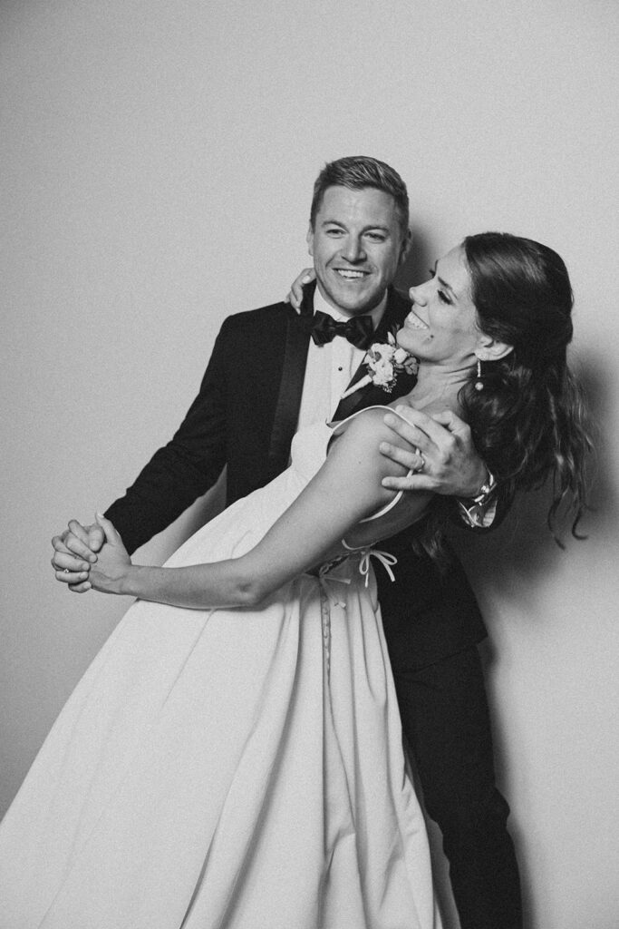 Black and white photo of bride and groom dancing at Rehoboth Beach wedding reception, Delaware wedding photographer Samantha Jay Photo