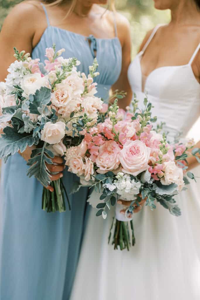 Bridesmaid and bridal bouquets with blush garden roses, snapdragons, and dusty miller at Rehoboth Beach Delaware wedding