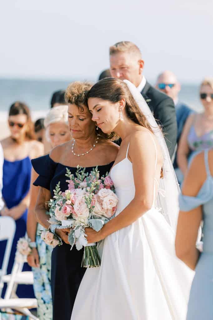 Emotional moment between bride and mother of the bride during beach wedding processional at Rehoboth Beach Delaware, Samantha Jay Photo